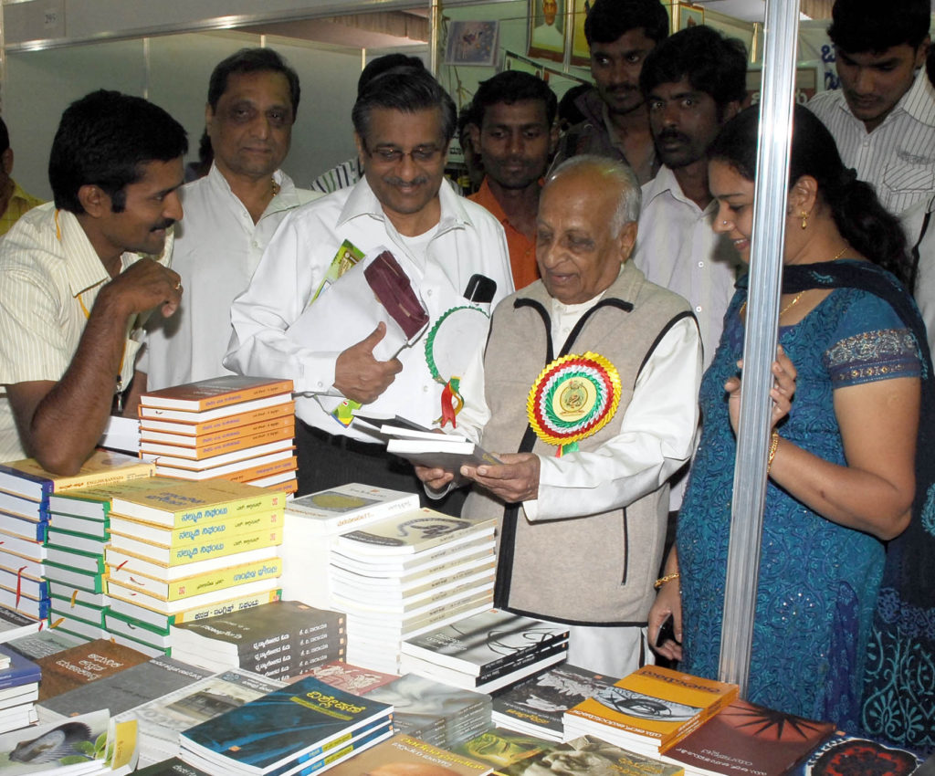 President of 77th All India Kannada Sahitya Sammelana Prof G Venkatasubbaiah visits books stalls during the 77th All India Kannada Sahitya Sammelana at National College Grounds in Bangalore on Sunday. KPN